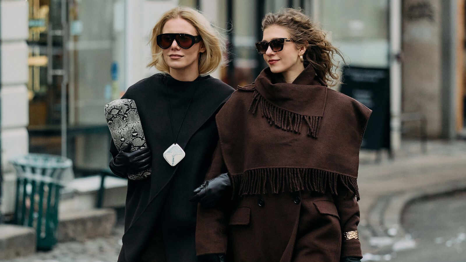 Two women holding arms at Copenhagen Fashion Week fall/winter 2026. 