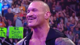 Randy Orton smiling at Cody Rhodes' Return to the WWE