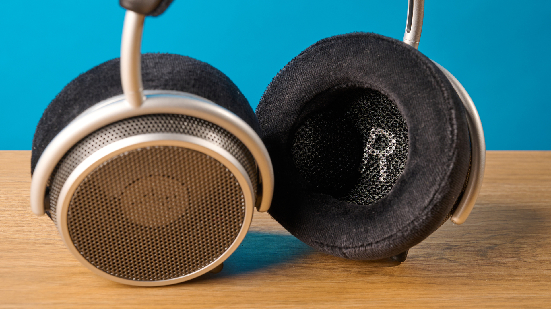 Grell OAE2 studio headphones photographed in front of a blue background