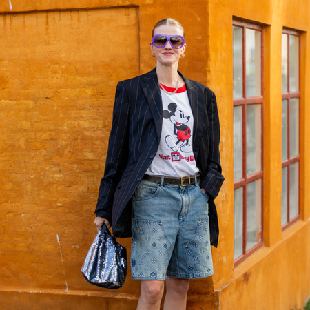 woman wearing denim shorts and graphic T-shirts