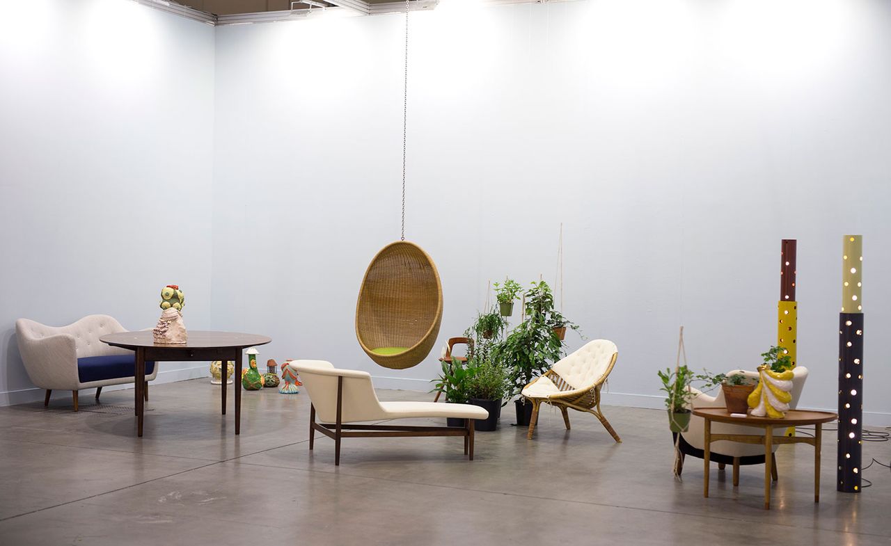 Sofas, chairs and tables setup in a museum styled room