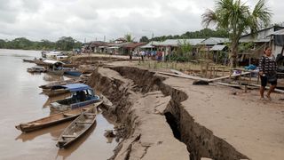 A general view shows a crack on the ground caused by a quake in Puerto Santa Gema, on the outskirts of Yurimaguas, in the Amazon region, Peru on May 26, 2019.