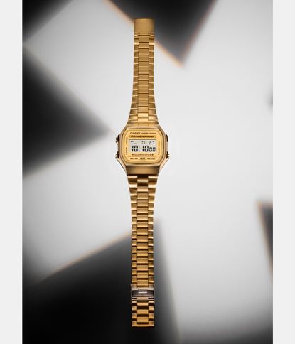 gold watch on white background