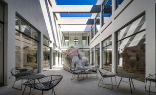 Courtyard seating area with large sculpture