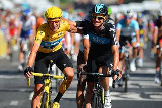 Bradley Wiggins and Michael Rogers arm in arm riding to the finish of stage 20 of the 2012 Tour de France