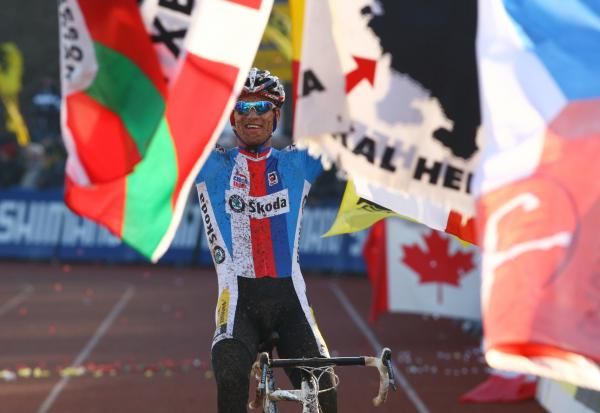 Zdenek Stybar (Czech Republic) rides through a colorful array of flags.
