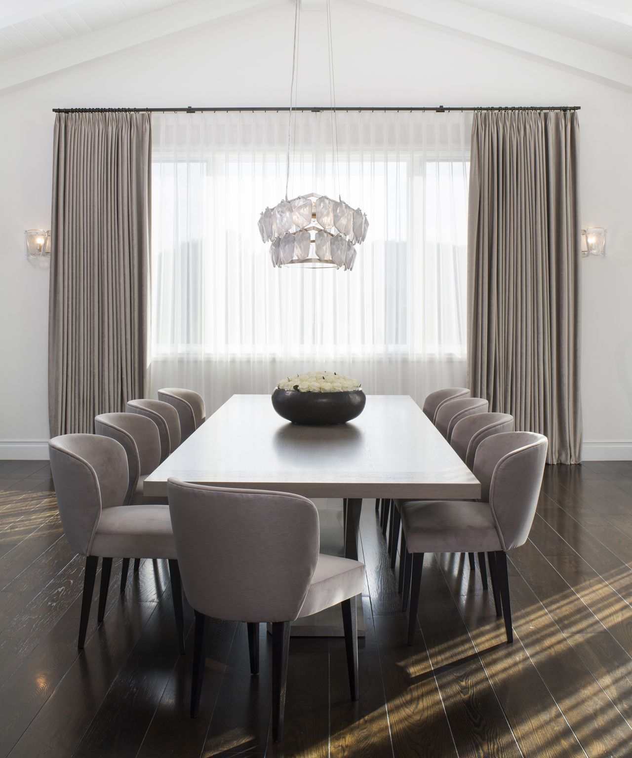 Large window curtain ideas with white sheer curtain under heavier gray curtains in the dining room