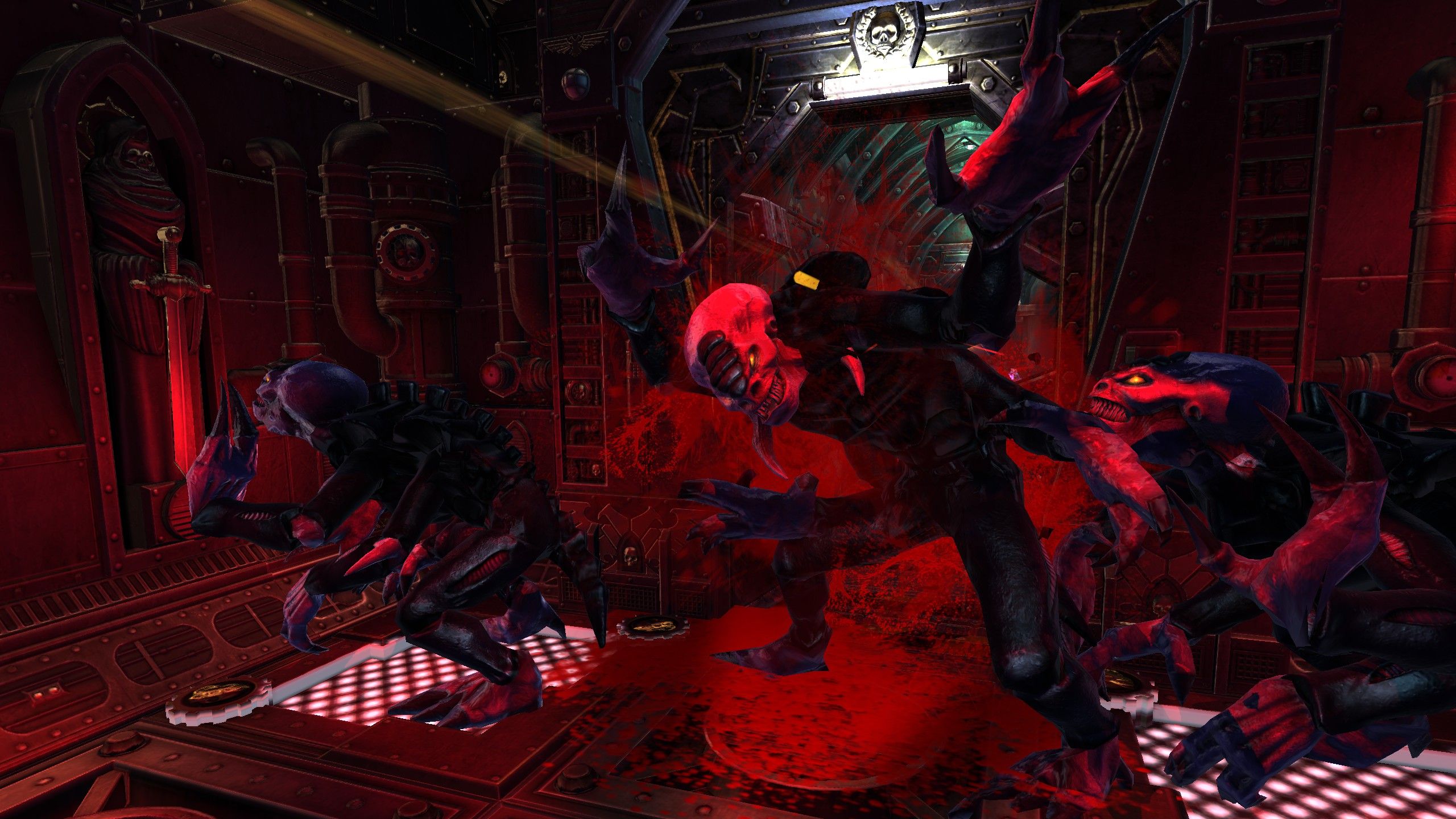 The middle of a trio of genestealers is turned to a fine red mist by a spray of bullets