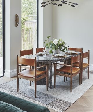 dining table and chairs on rug