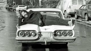 Bob Seger lies across the trunk of a car (a Ford Thunderbird) in Central Park, New York