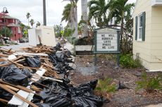 A sign is seen at the Pass-A-Grille Women's Club in St. Petersburg, Florida, ahead of Hurricane Milton's expected landfall. (Photo by Bryan R. SMITH / AFP via Getty Images)