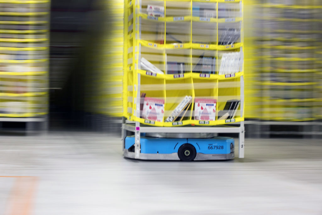 Robotic drive units move pods at an Amazon.com