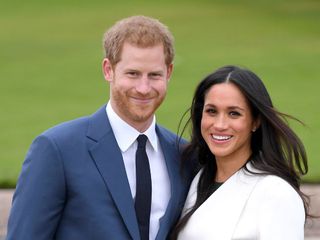 Prince Harry and Meghan Markle pose for photographs during their engagement announcement