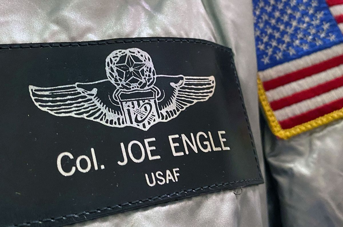 Joe Engle&#039;s name tag displays the U.S. Air Force astronaut wings that he earned flying the X-15 rocket plane before flying two space shuttle missions for NASA.