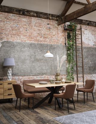 rustic dining area with exposed brick walls, ladder, modern chairs, retro feel