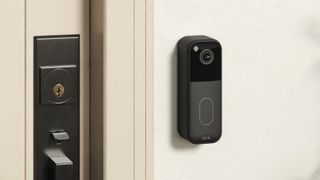 Blink Video Doorbell mounted on wall beside door