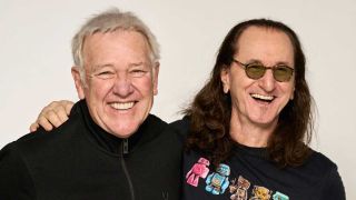 Alex Lifeson and Geddy Lee laughing