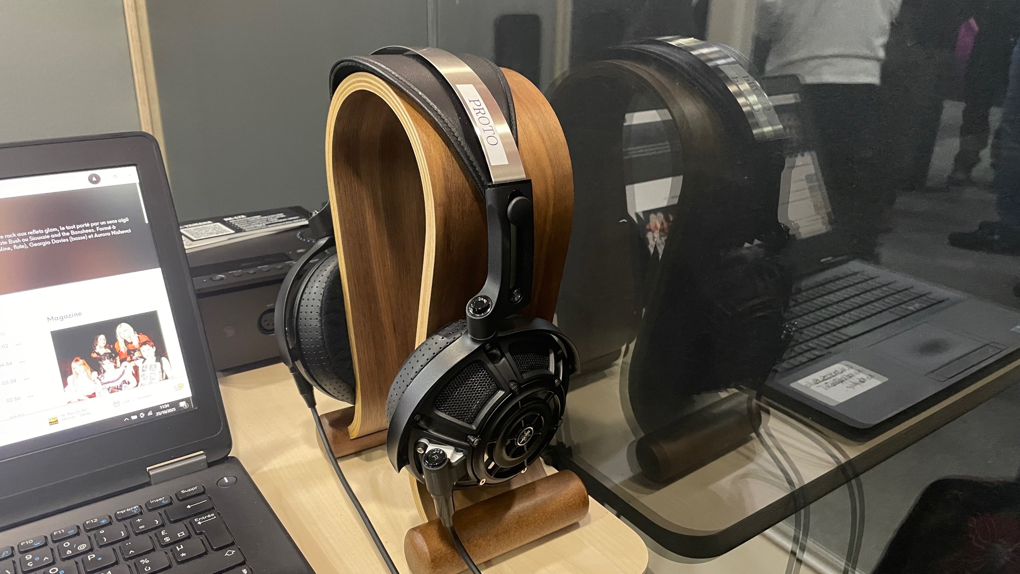 A selection of headphones, including the Audio-Technica ATH-ADX7000 worn by a man in Paris