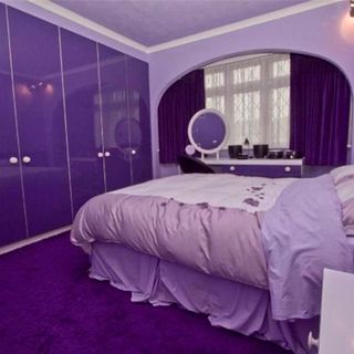 bedroom with purple wardrobe and purple carpet floor