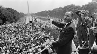 The civil rights leader Martin Luther King Jr. waves to supporters on Aug. 28, 1963 on the Mall in Washington D.C. (Washington Monument in background) during the "March on Washington."