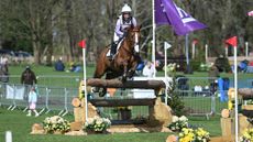Gemma Stevens and Chilli King jump a cross-country fence at Thoresby 2025.
