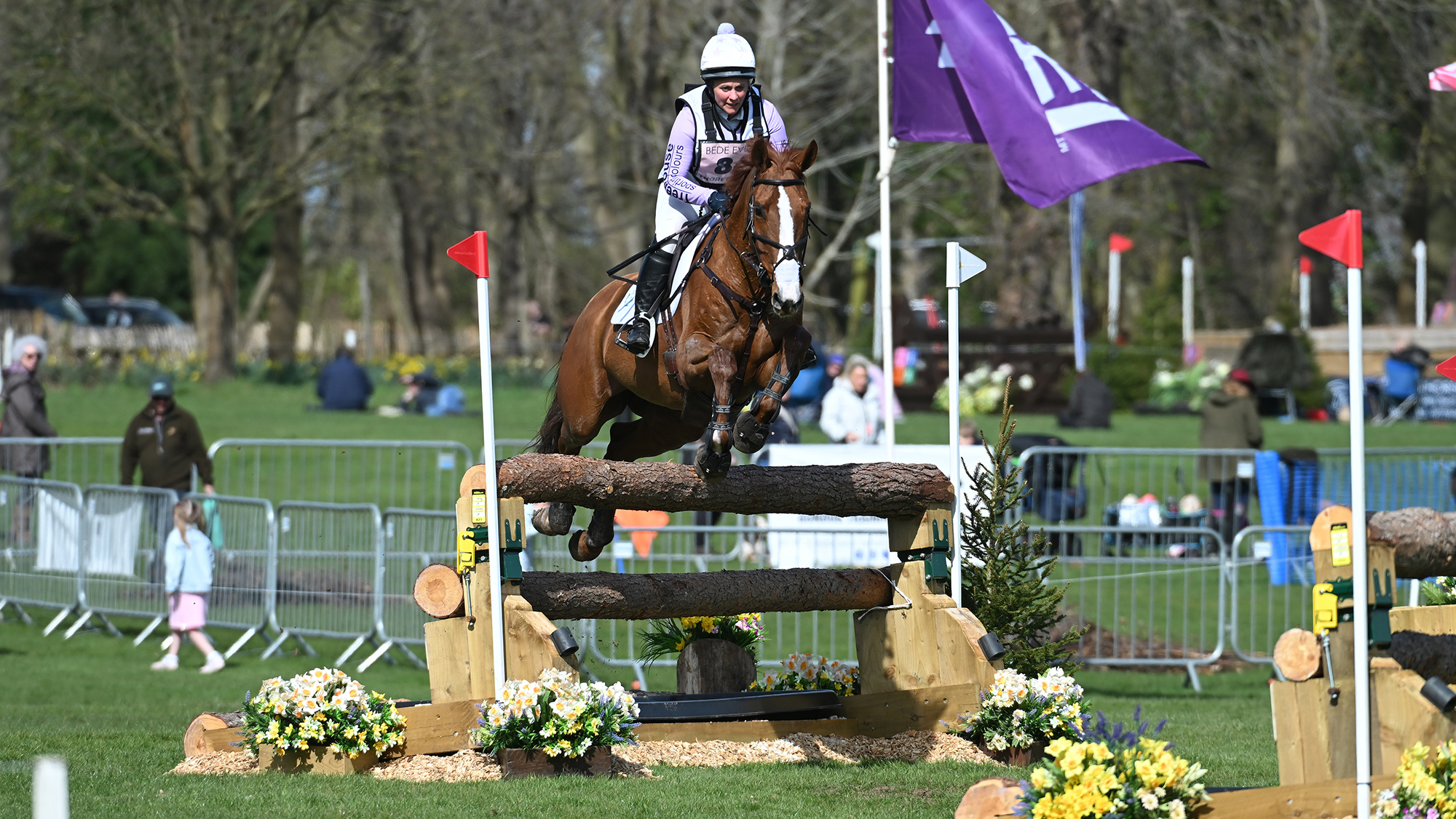 Gemma Stevens and Chilli King jump a cross-country fence at Thoresby 2025.