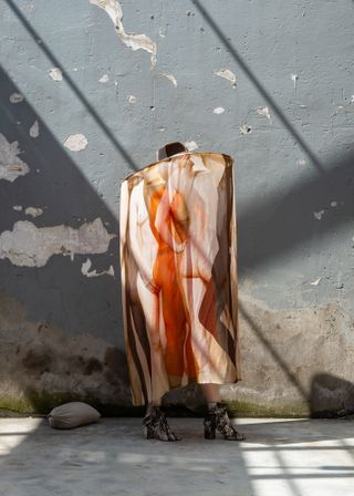 Cape by Buro Belen with print featuring human body
