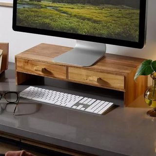 A wooden monitor stand