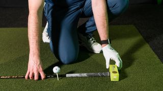 PGA pro Gareth Lewis setting up this drill for golf that'll help you hit up on the driver
