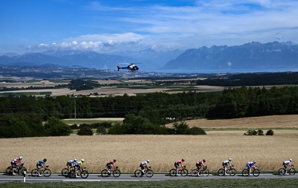 The pack of riders cycles during the 8th stage of the 109th edition of the of the Tour de France cycling race 1863 km between Dole in eastern France and Lausanne in Switzerland on July 9 2022 Photo by AnneChristine POUJOULAT AFP Photo by ANNECHRISTINE POUJOULATAFP via Getty Images