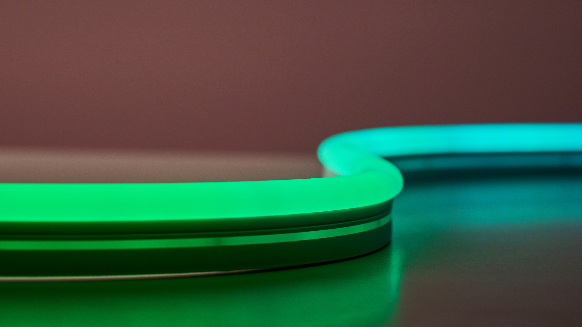 A close up of the rope light which is colored green and blue.