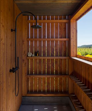 outdoor shower in wooden enclosure