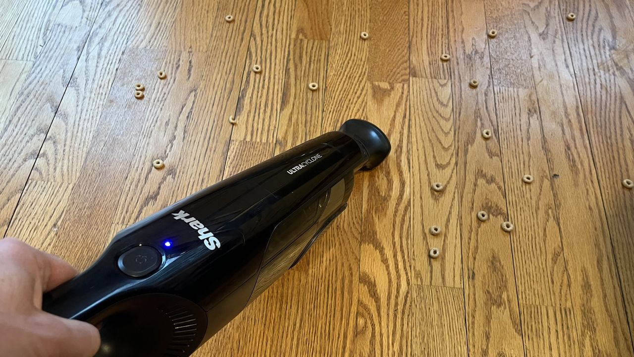 Shark Dual Cyclone Pet Pro vacuuming cheerios