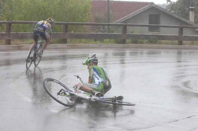 A Cannondale rider crashes on a slippery road