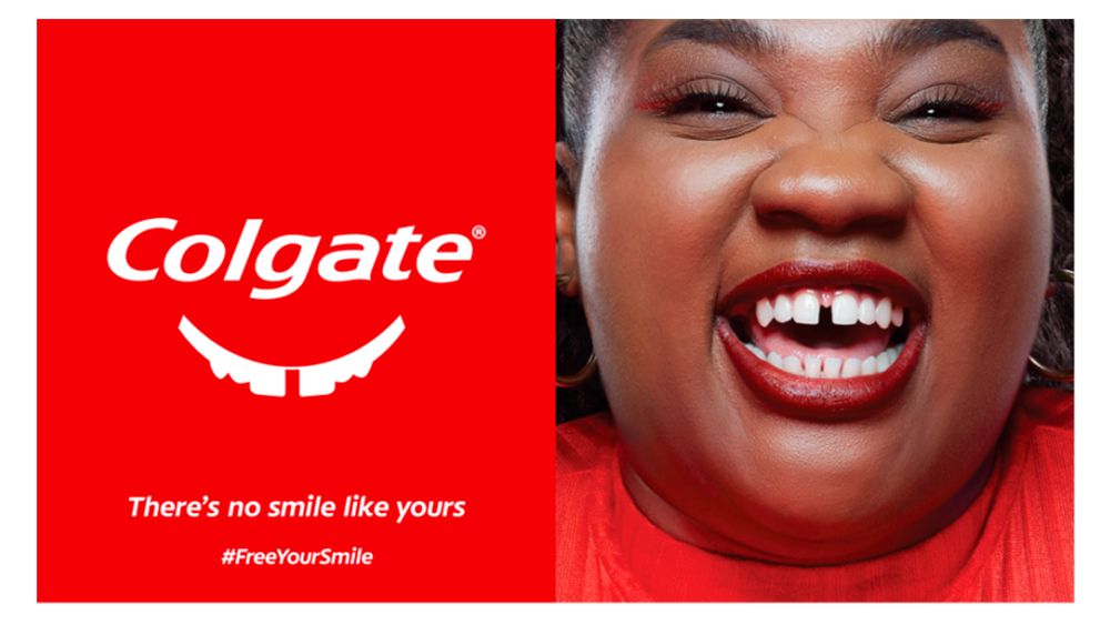 An image from a Colgate advertising campaign that show that Colgate logo with teeth