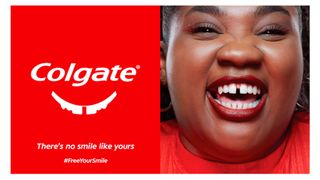 An image from a Colgate advertising campaign that show that Colgate logo with teeth