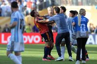 Leandro Paredes throttles Spain's defender #04 Eric Garcia at the end of the 2026 World Cup football tournament final match between Spain and Argentina. (Photo by JUAN MABROMATA / AFP)