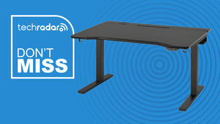 The IKEA UTMANING standing desk on a blue TechRadar-branded background next to a TechRadar badge that reads 'Don't Miss'