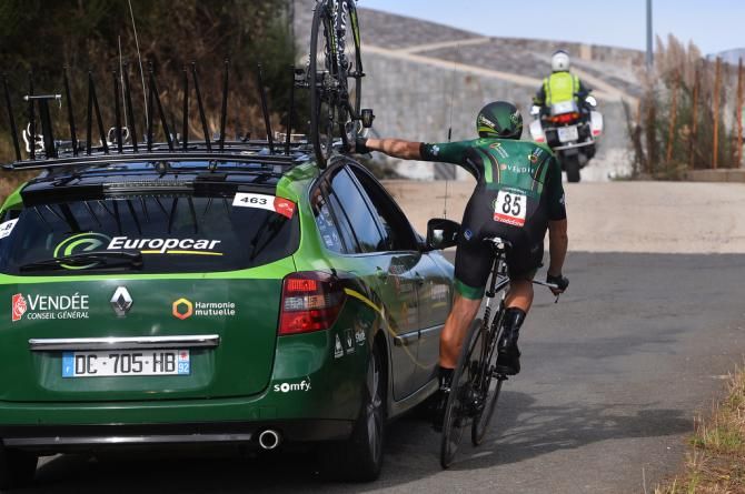 Jimmy Engoulvent (Europcar) grabs his team car for some support