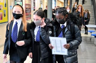 Children in school wearing face masks