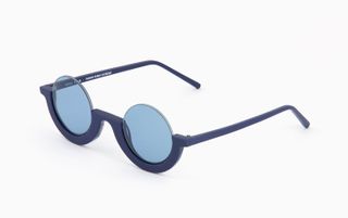 Blue tinted glass and blue half framed glasses