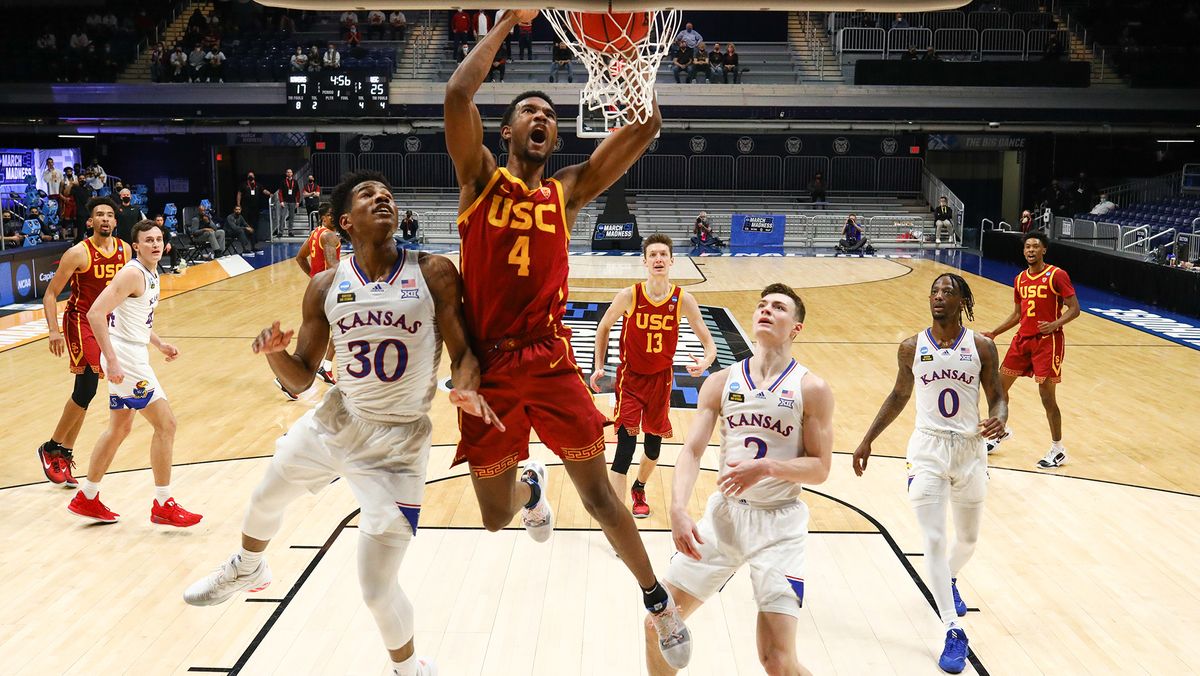 Evan Mobley #4 of the USC Trojans dunks on Ochai Agbaji #30 of the Kansas Jayhawks during the first half in the second round of the 2021 NCAA Division I Men&#039;s Basketball Tournament held at Hinkle Fieldhouse on March 22, 2021 in Indianapolis, Indiana.