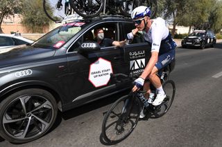 Chris Froome drops back to the team car at the UAE Tour