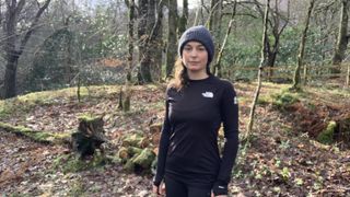 Woman on the trail wearing a beanie and The North Face Summit Series Pro 120 Crew