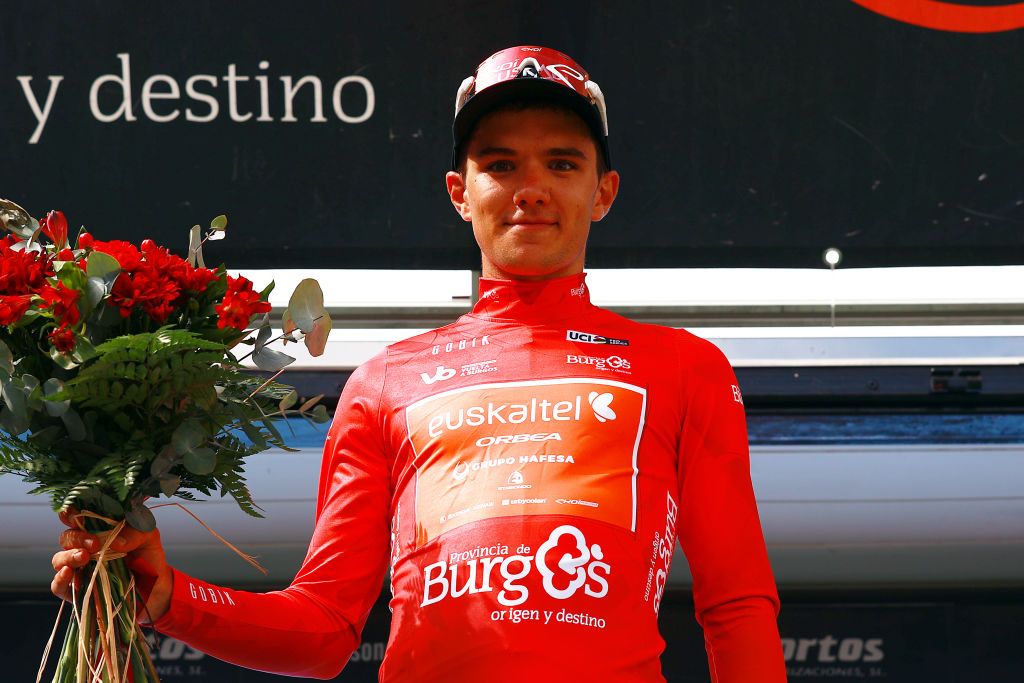 BURGOS SPAIN AUGUST 15 Xabier Berasategi Garmendia of Spain and Team EuskaltelEuskadi celebrates at podium as Red Mountain Jersey winner during the 45th Vuelta a Burgos 2023 Stage 1 a 161km stage from Villalba de Duero to Burgos on August 15 2023 in Burgos Spain Photo by Gonzalo Arroyo MorenoGetty Images