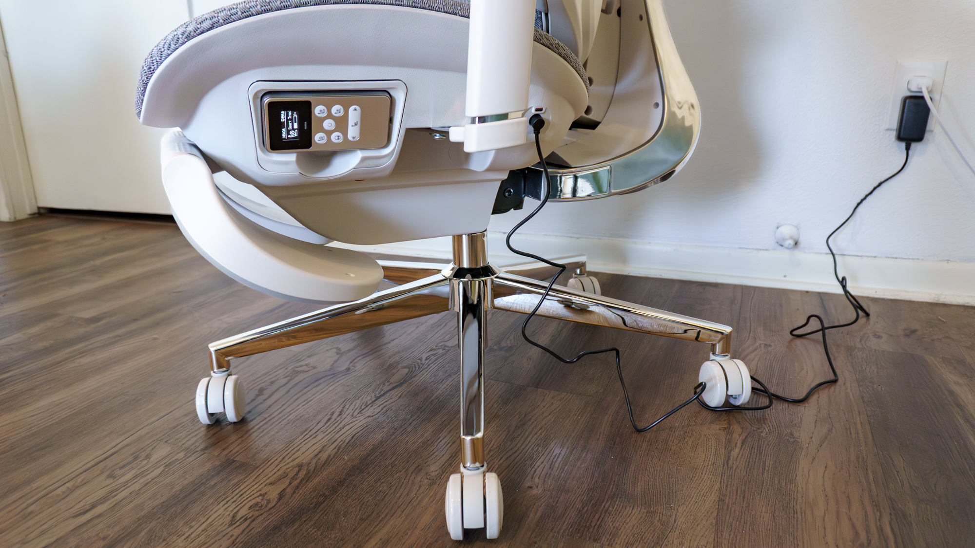 The Hbada X7 office chair plugged into the wall