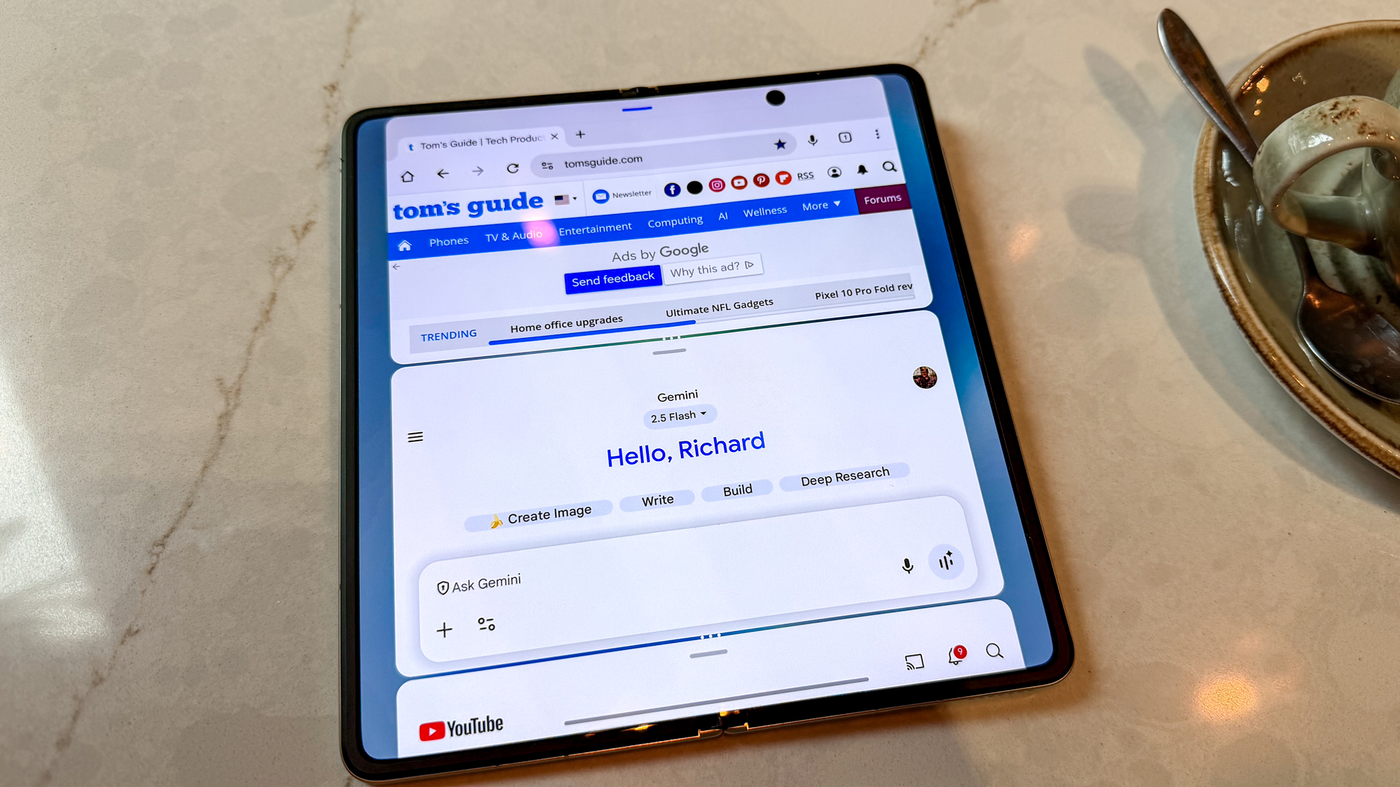 Honor Magic V5 with three apps open vertically