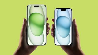 iPhone 15 and iPhone 15 plus in hand against neon green background