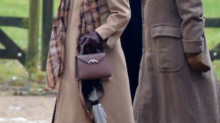 Queen Camilla's handbag close up as she departs after attending the Advent Sunday service