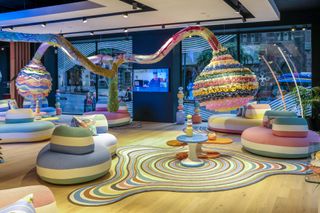 Showroom with colorful abstract furniture, rug and sculpture